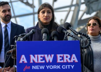 Lina Khan, center, speaks during a news conference Wednesday in the Queens borough of New York City. Mayor-elect Zohran Mamdani, left, named Khan co-chair of his transition team.