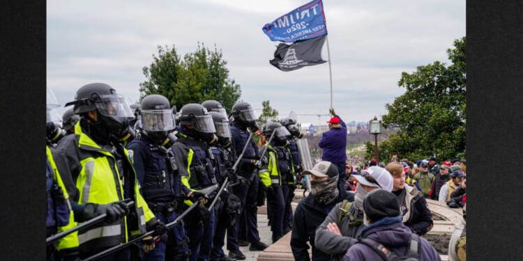 Capitol Hill police hold back protesters as crowds gather outside the U.S. Capitol for the "Stop the Steal" rally on Jan. 6, 2021, in Washington, D.C.