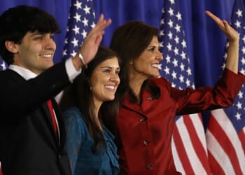 Then-presidential candidate Nikki Haley waves to supporters alongside her son, Nalin Haley, and her daughter, Rena Haley, in Charleston, South Carolina, on February 24, 2024.
