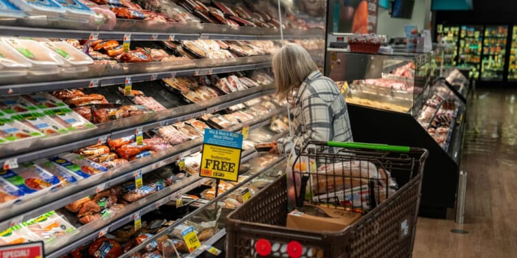 A shopper looks at a meat display on Nov. 4, 2025, at the Market 32 Supermarket in South Burlington, Vermont.