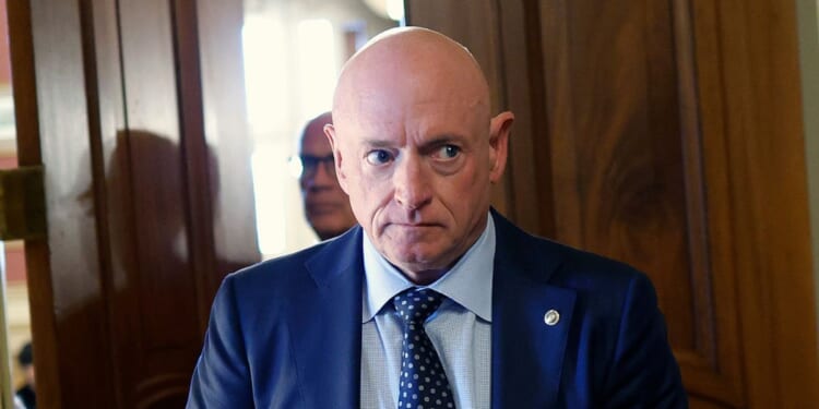 Sen. Mark Kelly leaves a Senate meeting in the US Capitol on Oct. 3, 2025 in Washington, DC.