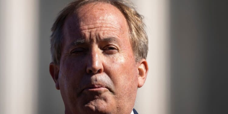 Texas Attorney General Ken Paxton speaks outside the U.S. Supreme Court on Nov. 1, 2021, in Washington, D.C.