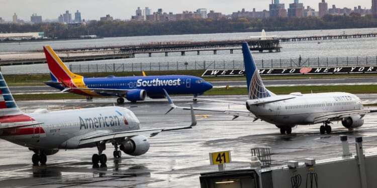 Planes line up on the tarmac at LaGuardia Airport on Nov. 10, 2025, in New York City.