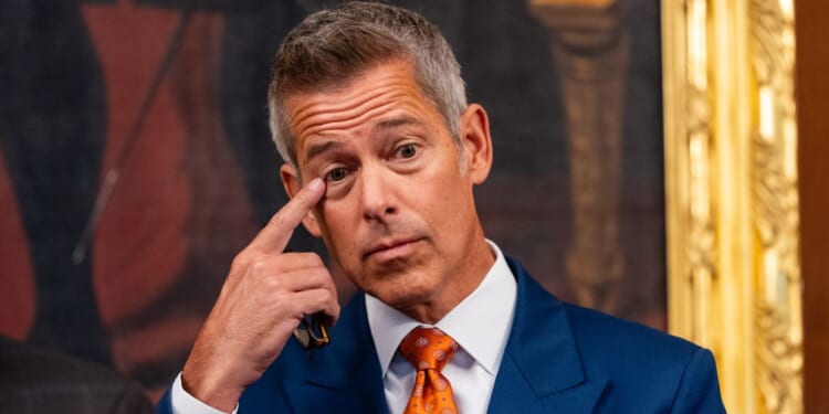 Transportation Secretary Sean Duffy touches his face during a news conference in the U.S. Capitol on Oct. 23, 2025 in Washington, DC.