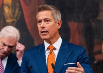Secretary of Transportation Sean Duffy speaks alongside Rep. Tom Emmer, a Republican from Minnesota, and Speaker of the House Mike Johnson, a Republican from Louisiana, during a press conference on air traffic controller pay and the government shutdown at the U.S. Capitol on Oct. 23, 2025, in Washington, D.C.