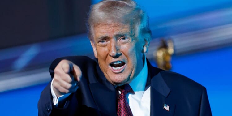 President Donald Trump gestures after delivering remarks during the America Business Forum in Miami, Florida, on Wednesday.