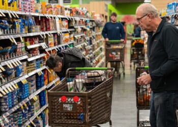 Shoppers look at a canned fish display Nov. 4, 2025, at the Market 32 Supermarket in South Burlington, Vermont.