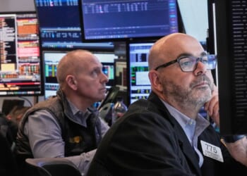 Wall Street hanging near its all-time high as calm continues to hold