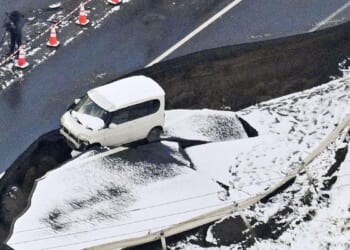 A 6.9 magnitude quake causes small tsunami waves off northeastern Japan