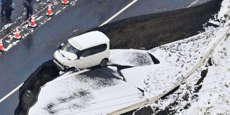 A 6.9 magnitude quake causes small tsunami waves off northeastern Japan