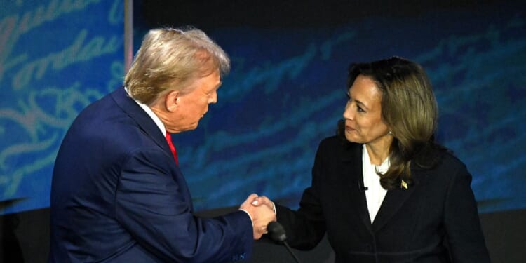 Vice President Kamala Harris shakes hands with President Donald Trump during a presidential debate at the National Constitution Center in Philadelphia, Pennsylvania, on Sept. 10, 2024.