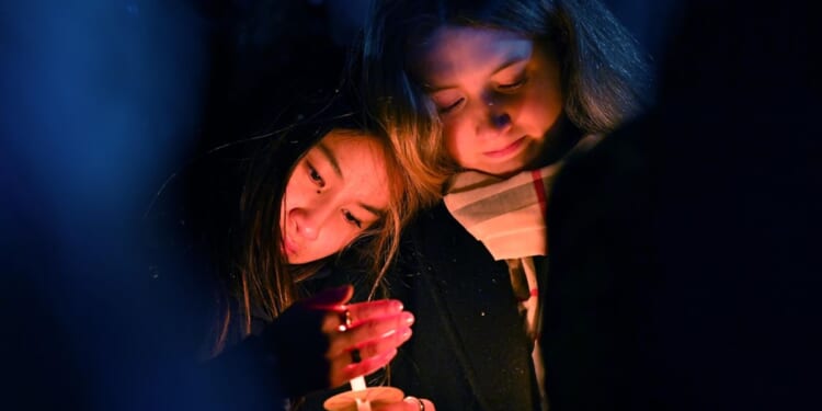 Search for the Brown University shooter resumes as questions swirl about campus security