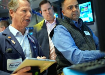 Wall Street holding steady as oil prices rise