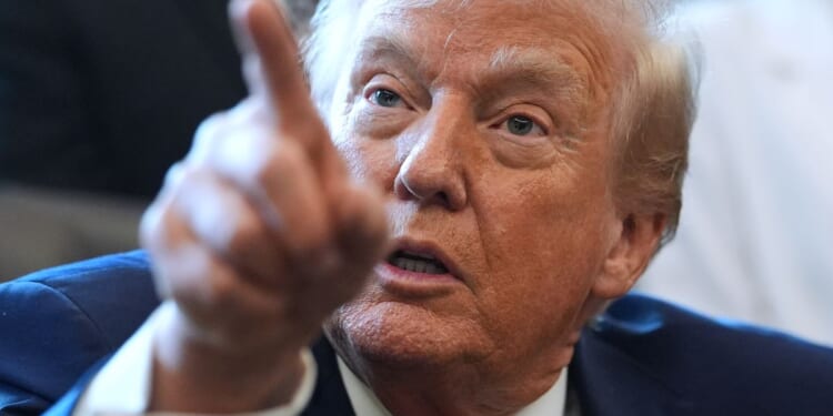 Trump signs defense policy bill into law