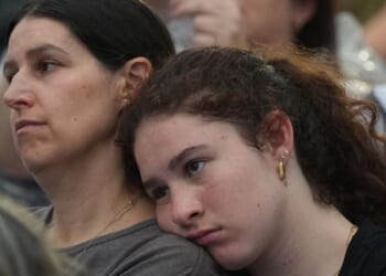 Gatherers at Bondi Beach mourn victims of antisemitic attack