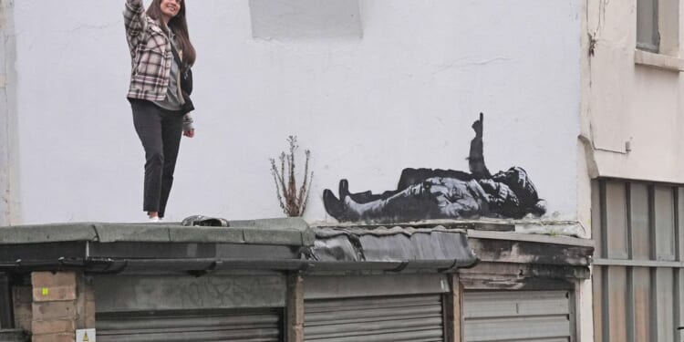 Banksy unveils new art in London following speculation over murals depicting stargazing figures