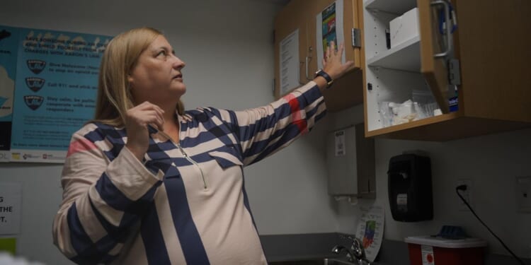 After Trump's order, addiction-stricken community struggles to keep a syringe program going