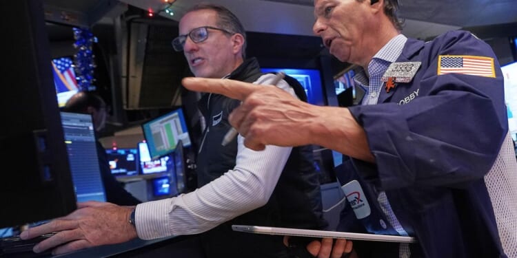 Stocks wavering as 2025 winds down while gold and silver rise