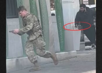 A suspect identified as Afghan national Rahmanullah Lakanwal, right, in black, has been charged with murder, assault, and weapons violations in connection with the ambush shooting of two National Guard members last week in Washington, D.C. One shooting victim has since died, and the other is reportedly fighting for his life.
