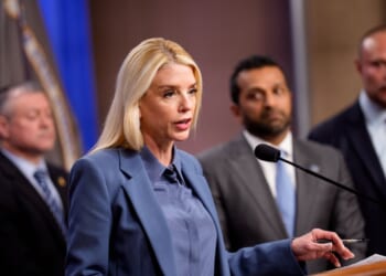 Attorney General Pam Bondi, accompanied by, FBI Director Kash Patel, FBI Deputy Director Dan Bongino, and FBI Washington Field Office Assistant Director in Charge Darren Cox, speaks during a news conference on an arrest of a suspect in the Jan. 6 pipe bombing case at the Department of Justice on Dec. 4, 2025, in Washington, D.C.