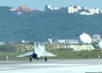In this image taken off video, a Taiwan fighter jet lands Monday at the Hsinchu Air Base in Taiwan.