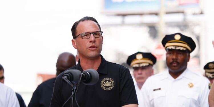 Pennsylvania Gov. Josh Shapiro speaks to members of the media near a collapsed portion of Interstate 95, caused by a large vehicle fire, in Philadelphia, Pennsylvania, on June 11, 2023.