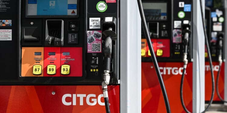 Gas pumps are seen at a CITGO gas station in Houston, Texas, on Dec. 2, 2025.