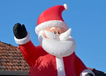 A large air inflatable Santa Claus Christmas outdoor decoration.