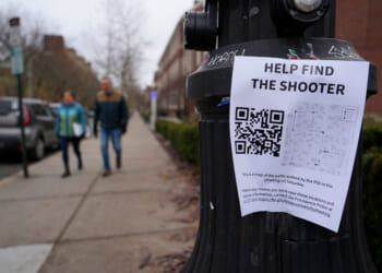 A poster seeking information about he campus shooting suspect at Brown University is seen on a lamppost in Providence, Rhode Island, on Dec. 17, 2025.