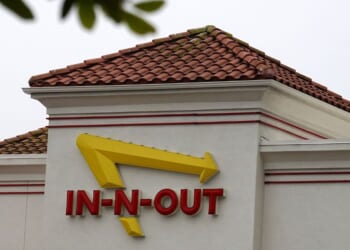 The In-N-Out Burger logo is displayed at an In-N-Out Burger restaurant on July 21, 2025, in Daly City, California.