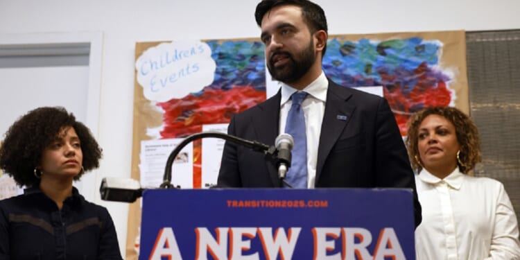 New York City Mayor-elect Zohran Mamdani speaks to the media on Wednesday with his then-Appointments Director Catherine Almonte Da Costa, left, and Jahmila Edwards, right, the head of the Mayor's Office of Intergovernmental Relations.