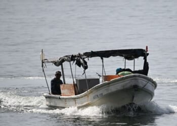 Fishermen sail on a boat near Caraballeda, La Guaira State, Venezuela, on Sept. 24, 2025.