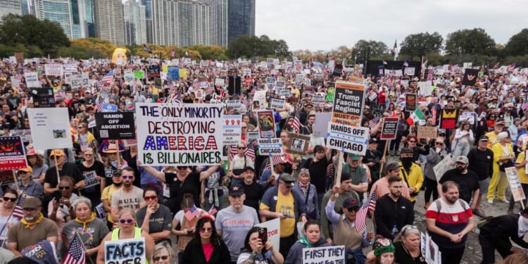 Protestors march in the second "No Kings" protest on Oct. 18, 2025, in Chicago, Illinois.