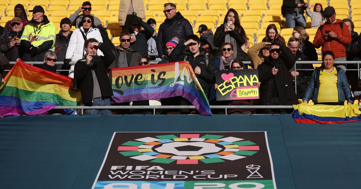 International soccer fans hold pride flags at the FIFA Women's World Cup Australia and New Zealand 2023 Quarter Final match on Aug. 11, 2023 in Wellington, New Zealand.
