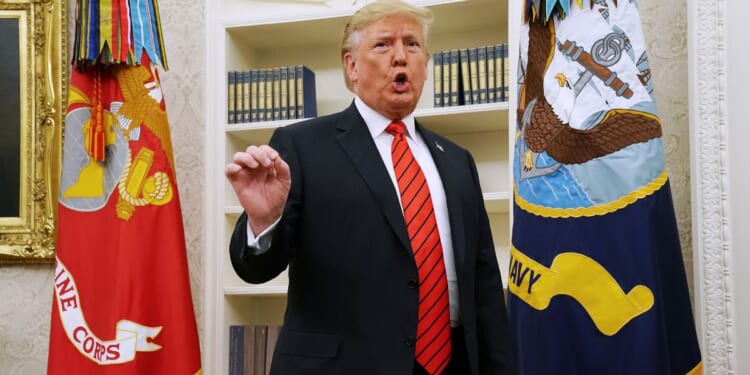 President Donald Trump gives pauses to answer a reporters' question about a whistleblower as he leaves the Oval Office after hosting the ceremonial swearing in of Labor Secretary Eugene Scalia at the White House on Sept. 30, 2019, in Washington, D.C.