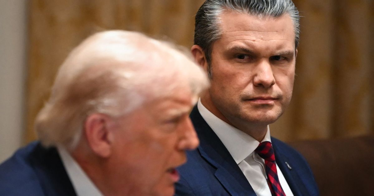 President Donald Trump speaks alongside Secretary of War Pete Hegseth during a Cabinet meeting in the White House in Washington, D.C., on Dec. 2, 2025.