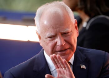 Then-Democratic vice presidential nominee, Minnesota Gov. Tim Walz reacts as Democratic presidential nominee, U.S. Vice President Kamala Harris concedes the election during a speech at Howard University on November 6, 2024 in Washington, DC.