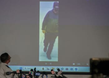 Police Chief of the Providence Police Department Colonel Oscar Perez shows an image of a person of interest in the Brown University shooting on Dec. 15, 2025 in Providence, Rhode Island.