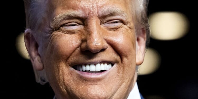 President Donald Trump smiles at a Heads of State and Government summit in The Hague on June 25, 2025.