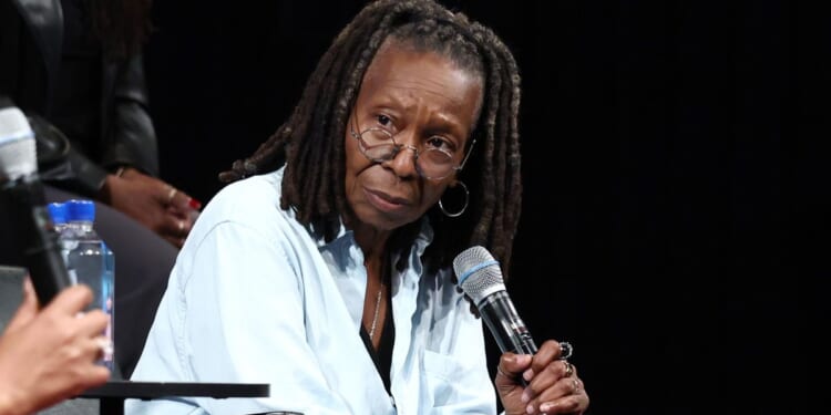 Whoopi Goldberg listens onstage at Storytellers alongside Rep. Jasmine Crockett in New York City on June 13, 2025.