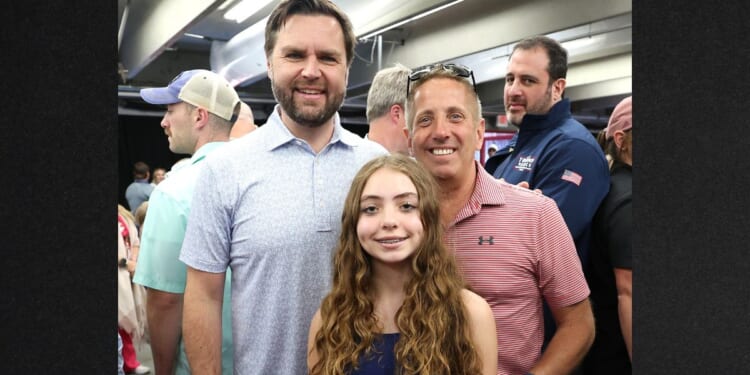 Former NASCAR Cup Series driver, Greg Biffle, right, and his daughter Emma Elizabeth Biffle posed for a photo with then-Republican vice presidential nominee J.D. Vance on Oct. 13, 2024, at Charlotte Motor Speedway in Concord, North Carolina. Biffle, his wife Cristina, daughter Emma and son Ryder were killed in a plane crash Thursday.