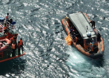 Indonesian rescuers find a second body as search for Spanish soccer coach and 2 children extended