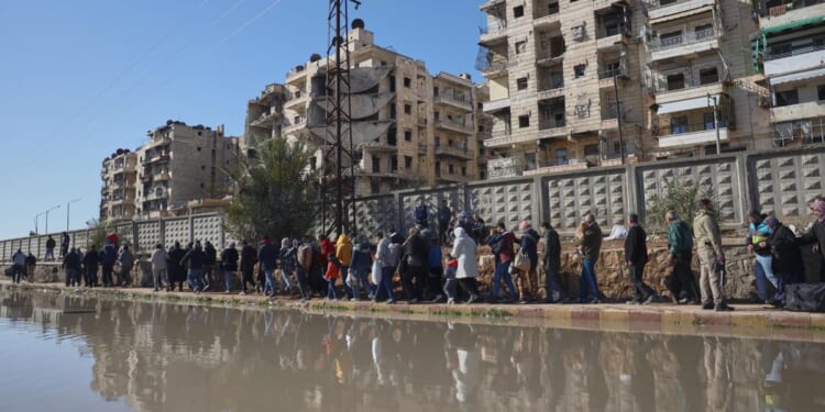 After days of violent clashes, Kurdish fighters evacuated from Aleppo