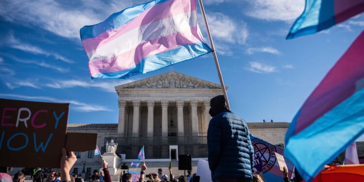 Dueling rallies on transgender-athlete laws draw hundreds to Supreme Court