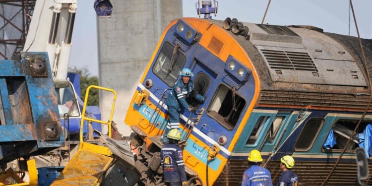 Construction crane crashes onto a moving train in Thailand, killing at least 32 people