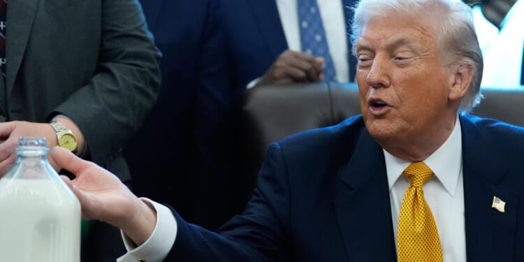 Glass bottle of milk gets a perch on Trump's desk but takes a back seat at bill signing