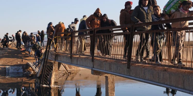 Civilians flee on foot as Syrian military offensive looms east of Aleppo