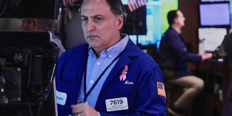 Stocks waver on Wall Street and remain near records