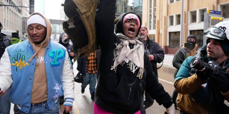 During Minneapolis immigration crackdown, counterprotesters chase off conservative influencer