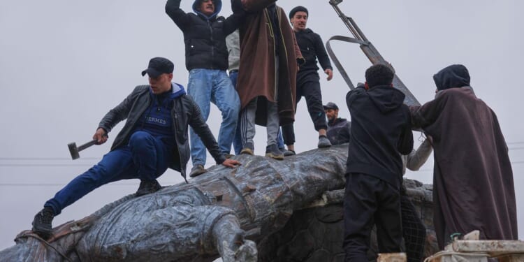 In ongoing push into Kurdish-held areas, Syrian government forces sweep into Raqqa